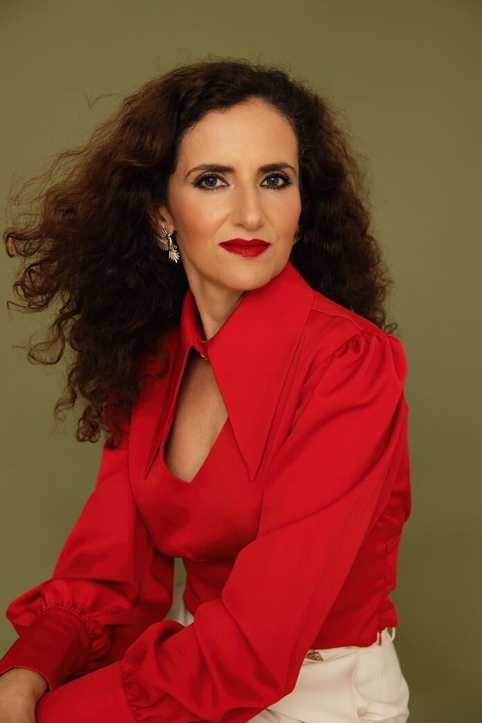 Photo of curly woman in red, Berlin studio Photo of curly woman in red, Berlin studio photoshoot