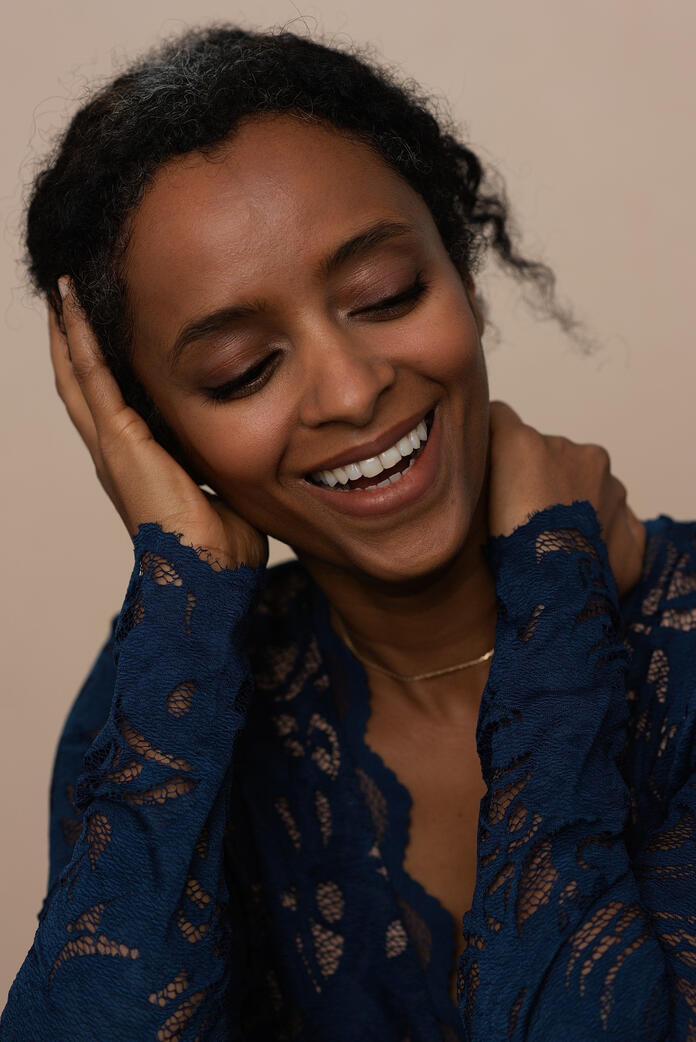 Untitled Photo of dark skin woman in blue lace, Berlin studio