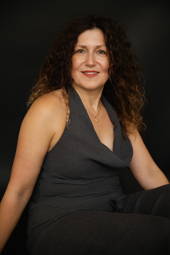 Photo of mid age woman in grey, Berlin studio Photo of mid age woman in grey, Berlin studio photoshoot